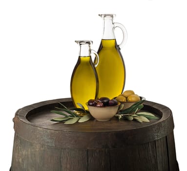 Bottles of Extra virgin healthy Olive oil with barrel background
