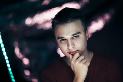 portrait of a young man on a blurred background.