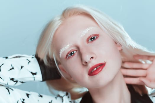 portrait of blonde albino girl in studio.