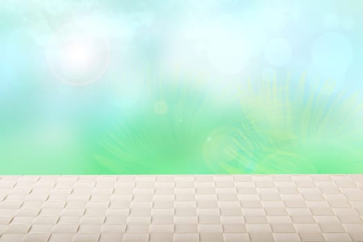 Table top on sunny spring background. A empty bright table on blurred abstract sunny spring or summer day with blue sky. Template for your product display montage. Summer and holiday concept.