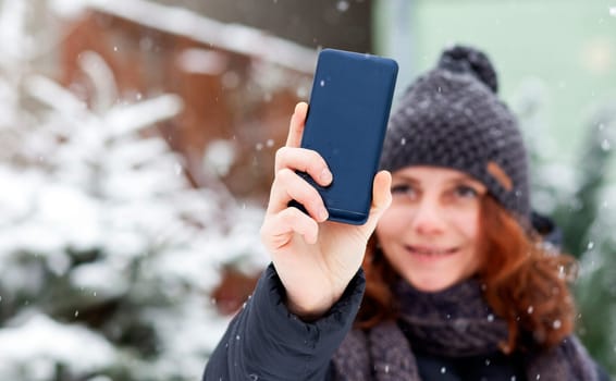 woman taking a selfie in snow