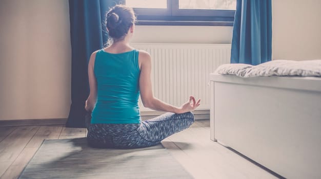 woman doing yoga at home