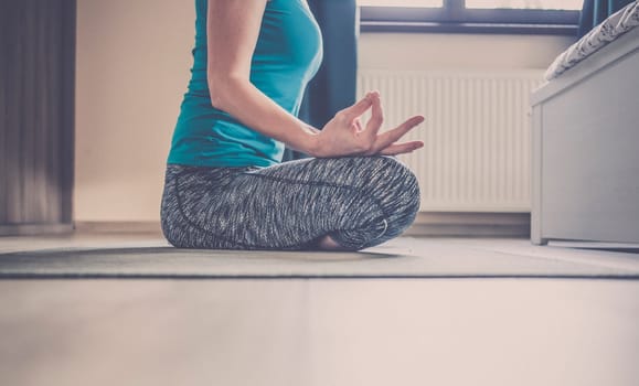 woman doing yoga at home