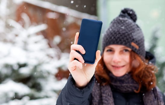 woman taking a selfie in snow