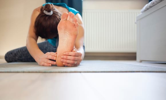 woman doing yoga at home