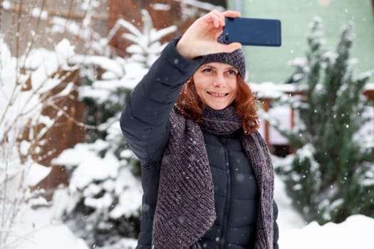 woman taking a selfie in snow
