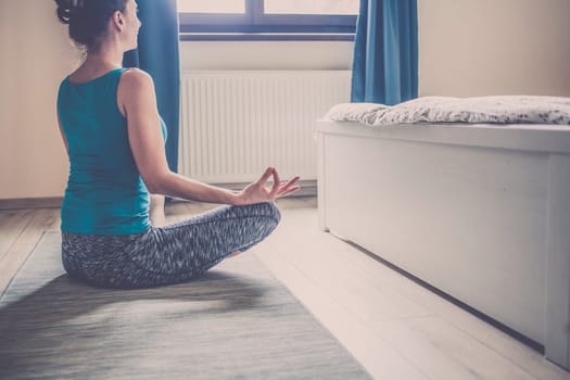 woman doing yoga at home
