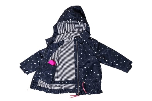 Kids jacket isolated. A stylish fashionable dark blue jacket with white dots and blue white striped lining for the little girl. A rain coat and windbreaker with hood for spring and autumn.