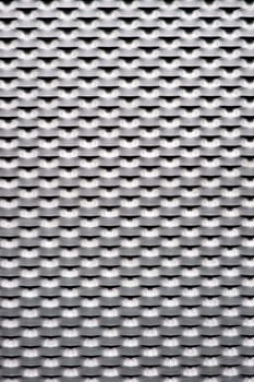 The close-up of a stamped corrugated sheet and expanded metal.....