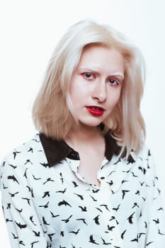 portrait blonde albino girl in studio on white background.