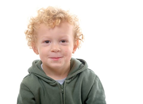 portrait of a little boy of 3 years with a green coat on the white background