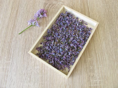 Dried lilac flowers in wooden box
