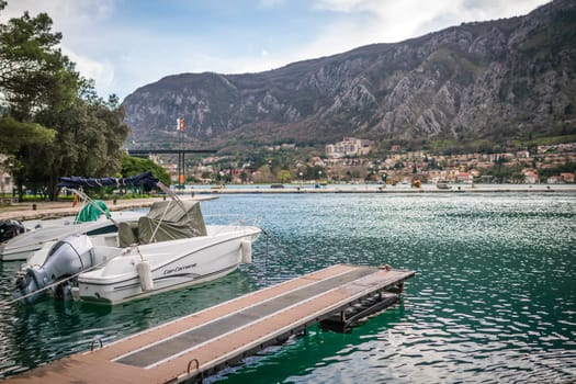 Kotor, Montenegro - April 2018 : Private motorboat moored on shore of Kotor Bay