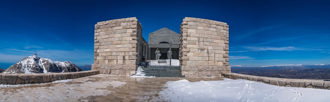 Mt Lovcen, Montenegro - April 2018 : Panoramic view of the two tall statues guarding the entrance to the Njegos Mausoleum on Mount Lovcen