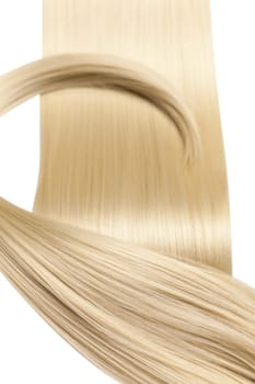 Closeup on luxurious straight glossy blonde hair