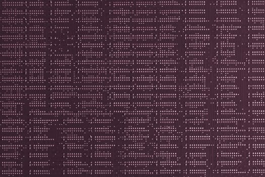 Computer technology background. Close up of purple digital electronic printed circuit board. Solder side. Macro of a PCB.