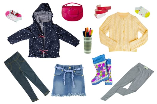 Collage set of little child girl clothes isolated on a white background. Collection of rain jacket, sweater, jeans, jeans skirt, rubber boots, pants and handbag.