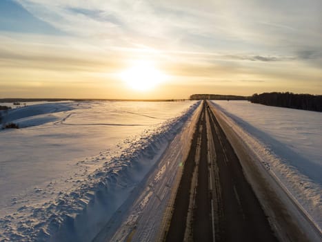 Aerial view of a road in winter landscape
