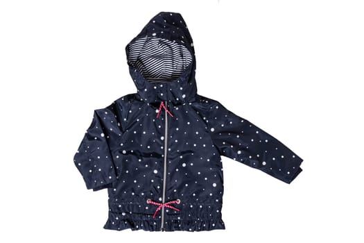 Kids jacket isolated. A stylish fashionable dark blue jacket with white dots and blue white striped lining for the little girl. A rain coat and windbreaker with hood for spring and autumn.