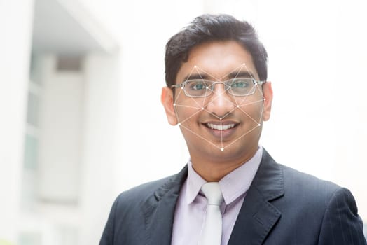 Biometric verification. Human facial detection, high technology. Indian man face ID scanning.