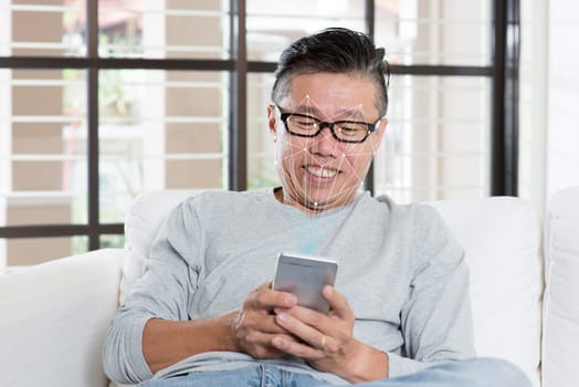 Biometric verification. Human facial detection with smartphone, high technology. Asian man face ID scanning.