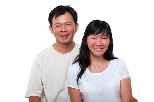 Asian mature couple sitting with smiling face, on white background.