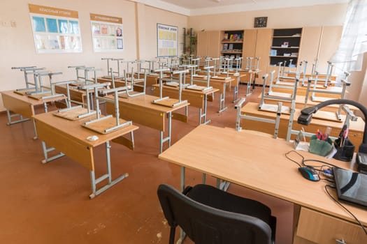 Anapa, Russia - January 26, 2019: Empty classroom in school, teacher in the foreground