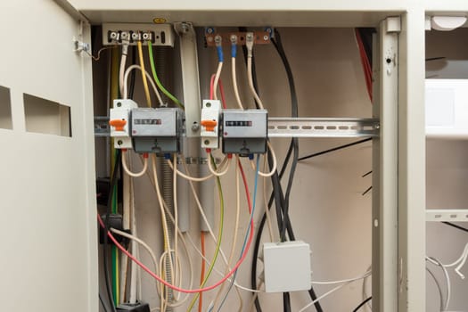 Two electronic electrical meters and a junction box