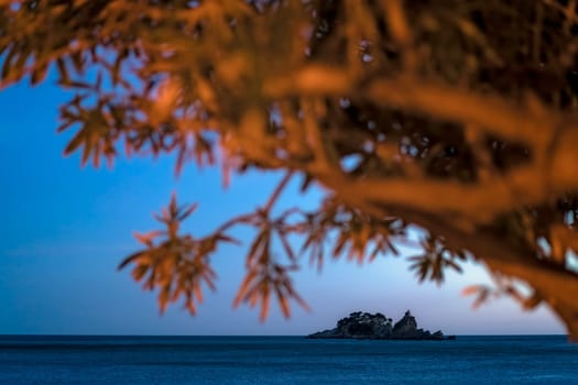 Small secluded monastery on the tiny rocky island in Petrovac bay in Montenegro, the Adriatic sea
