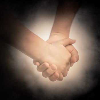 Little Caucasian boy walking together with his sister holding hands
