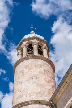 The bell tower of the basilica of Our Lady of the Rocks in Kotor Bay, Perast, Montenegro.