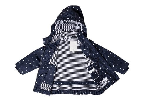 Kids jacket isolated. A stylish fashionable dark blue jacket with white dots and blue white striped lining for the little girl. A rain coat and windbreaker with hood for spring and autumn.