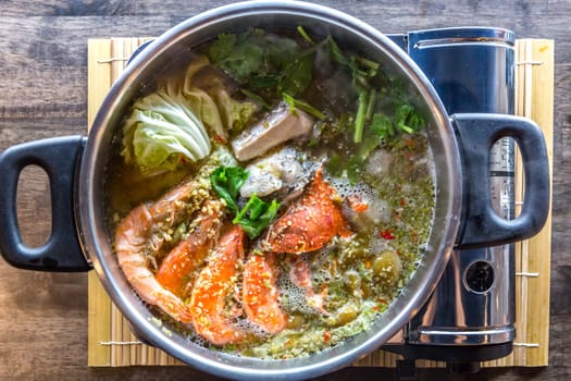 Seafood spicy hot pot crab prawn fish squid tumyum