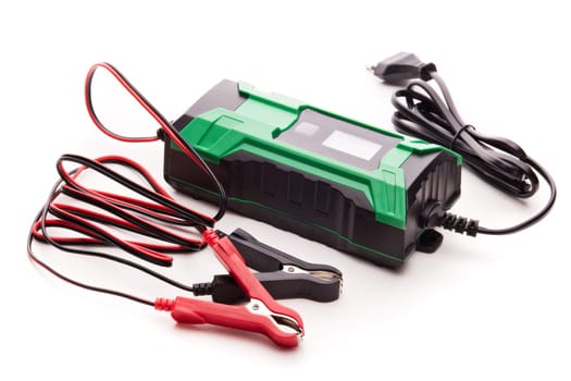Smart multi purpose battery charger. Car battery charger isolated on a white background. Concept of service, maintenance, charging car battery, diy