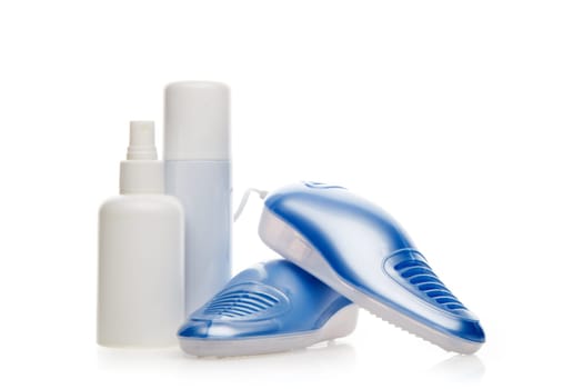 Electric shoes dryer with UV sterilization on a white background, Deodorant for shoe and antifungal agent. Shoe care products. Concept of healthy feet