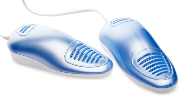Electric shoes dryer with UV sterilization on a white background, Deodorizer and antifungal effect. Concept of healthy feet