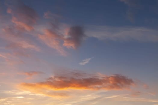 Sunset sky and pink clouds with a blue background sky.