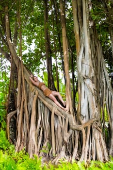 Wild woman climbing on trees