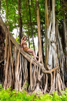 Wild woman climbing on trees