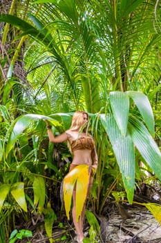 Wild woman hidden in the green jungle