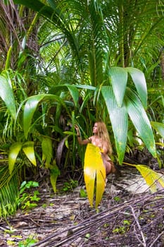 Wild woman hidden in the green jungle