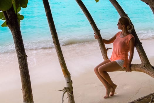 Beautiful woman resting by the sea