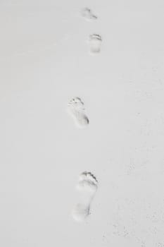 Human footprints by the sea