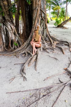 Young woman in the wild forest