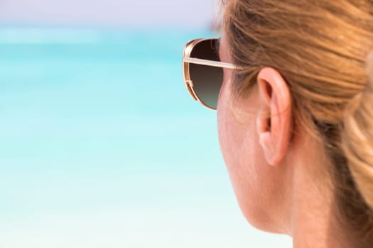 Young girl sunbathing on the beach