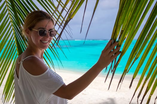 Blonde woman on the tropical beach
