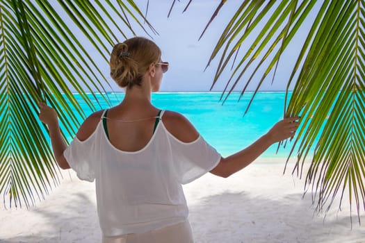 Blonde woman on the tropical beach