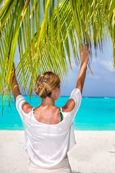 Blonde woman on the tropical beach