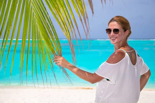 Blonde woman on the tropical beach