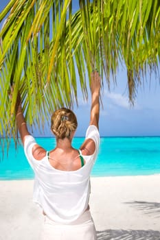 Blonde woman on the tropical beach